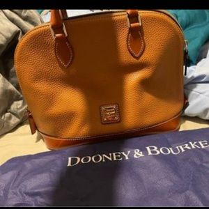 Dooney & Bourke pocketbook, bought it and never toted it.